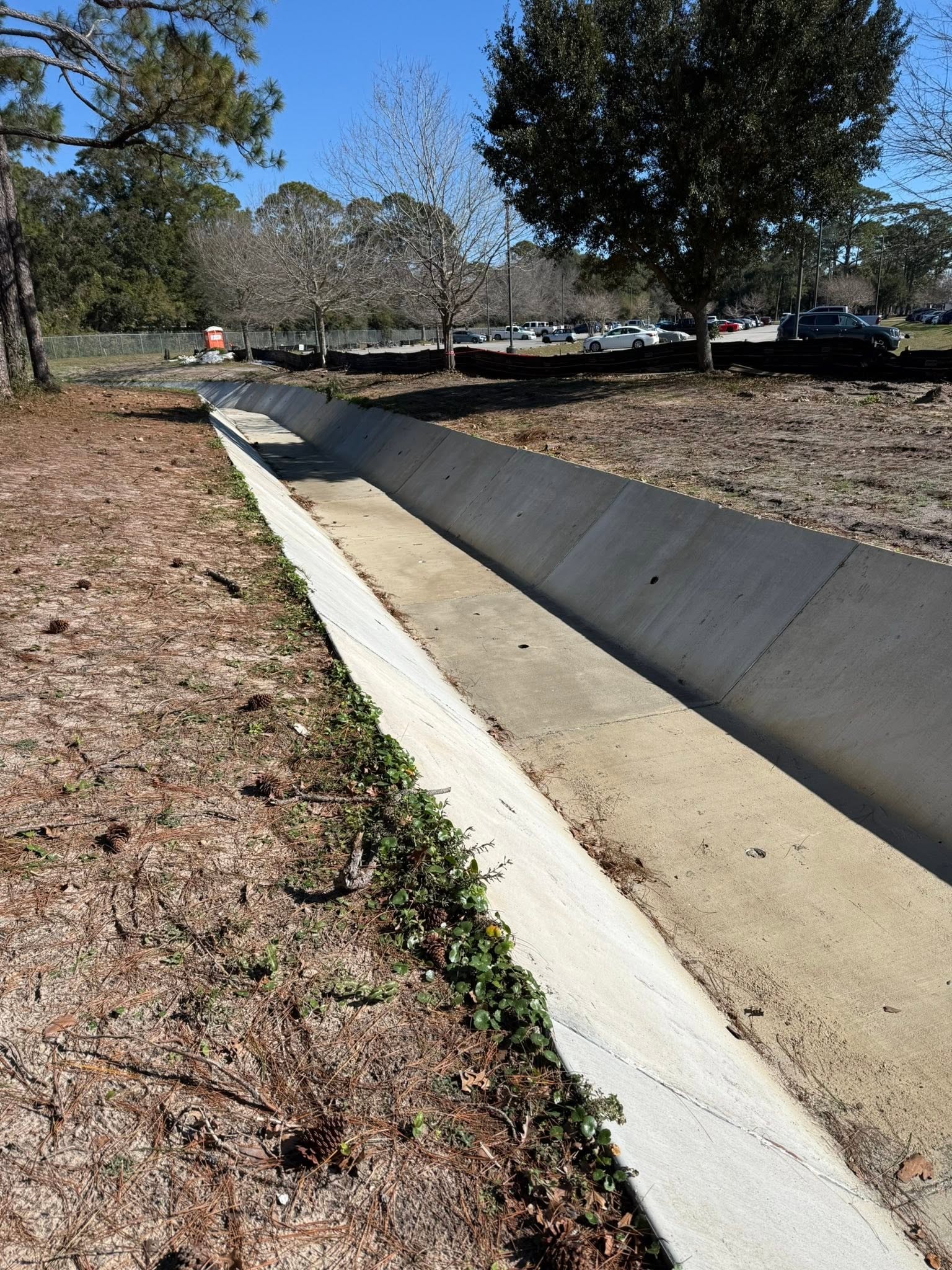 Concrete drainage channel berm